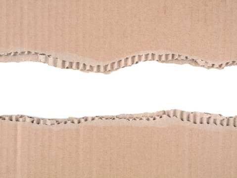 Torn brown corrugated cardboard with a ripped open center revealing white space. Perfect texture background for design mockups, banners, advertising, and creative microstock projects