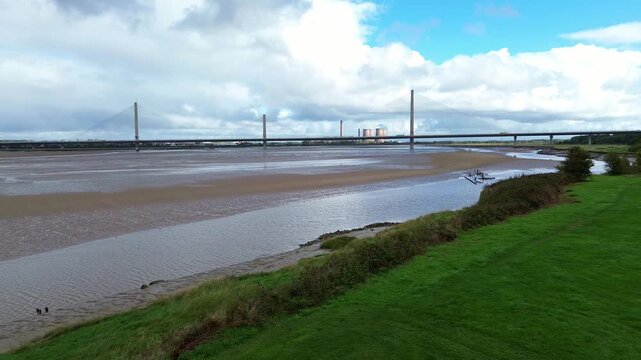 Mersey gateway bridge aerial view across Wigg island Mersey river at low tide