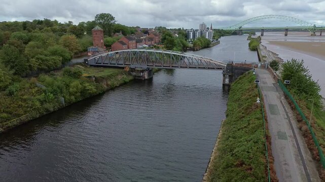Aerial view establishing ship canal and Runcorn old quay iron swing bridge