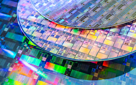 Silicon Wafers with microchips used in electronics for the fabrication of integrated circuits