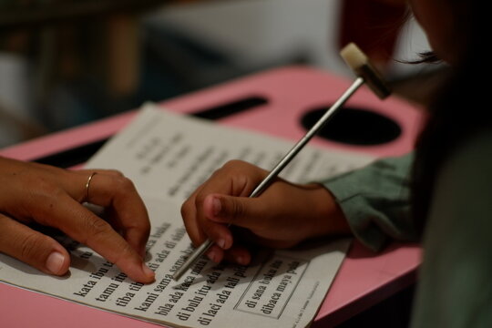 Close Up of Mother Teaching Her Daughter Studying