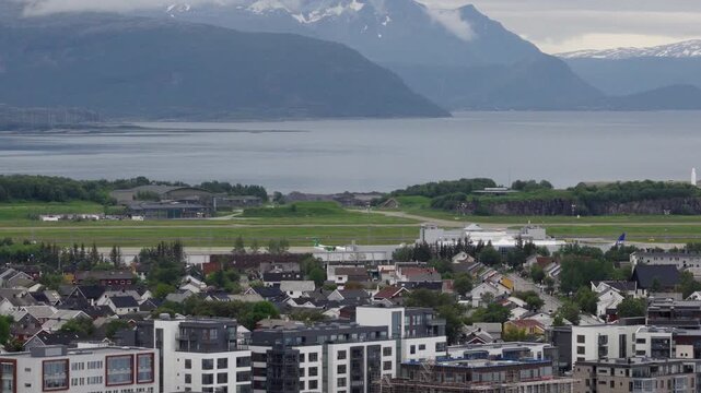 Wideroe airplane landing at Bodo airport in Norway, aerial riser
