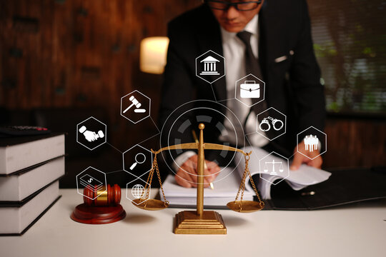 Lawyer Reviewing Contract with Legal Technology Icons and Scales of Justice