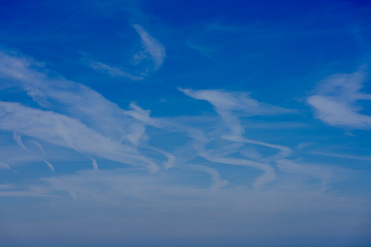 Arromanches-les-Bains, France - 08 10 2026: Sky Background. Detail view of white clouds forming strange shapes in a blue sky.