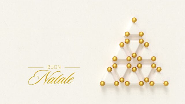 Christmas tree made from embossed paper triangles and golden baubles. Italian language Merry Christmas message (Buon Natale) appearing and dissolving. Loopable video
