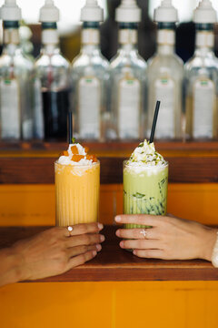 Mango and Matcha Shakes with Whipped Cream Close-Up