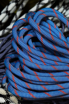 Coiled Blue Climbing Rope and Equipment