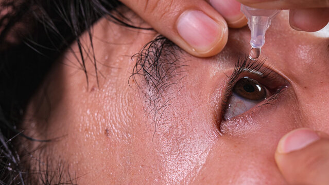 Close-Up Man Applying Eye Drops Artificial Tears