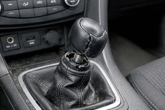 A close-up shot of a gear shift lever in a vehicle