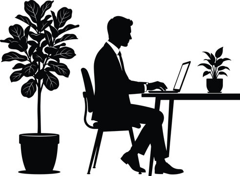 Silhouette of a businessman in a suit sitting at a desk and working on a laptop, accompanied by a large potted fiddle leaf fig plant and a small desk plant