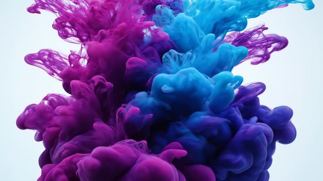 Vibrant purple and blue ink clouds swirling together in water