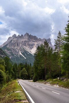 Stunning view of steep cliff of Monte Cristallo massif north face, in Ampezzo Dolomites Natural Park from SS51 national road in summer, Belluno, Veneto, South Tyrol, Italy