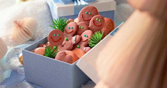 Cute gingerbread men in light blue present boxes.