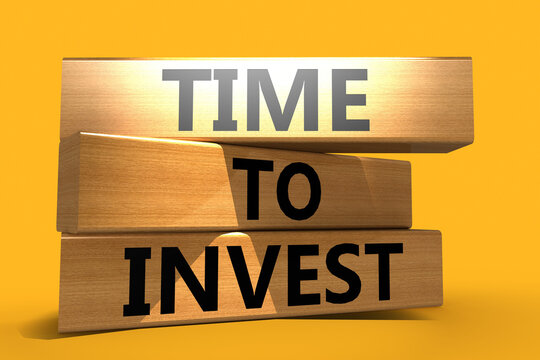 Time to invest word on wooden cube blocks