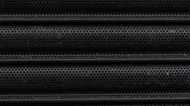 Perforated metal security shutter pattern