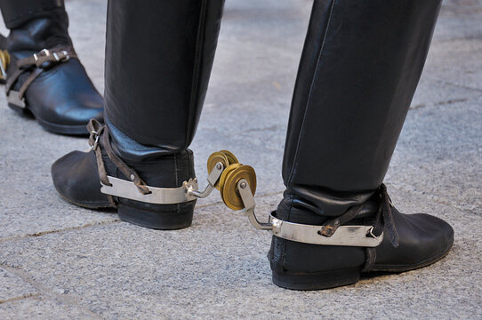 Detail of black boots with spurs
