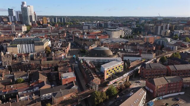 Aerial Video of Train on Railway Viaduct and Leeds Skyline at Sunrise