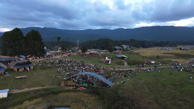 Crowd enjoying Ziro Music Festival surrounded by mountain landscape in Ziro, Arunachal Pradesh