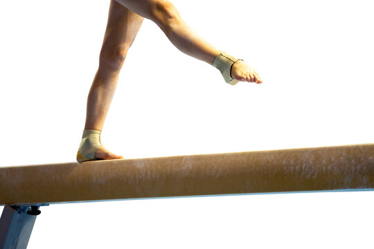 Female gymnast's legs walking on balance beam isolated in transparent background