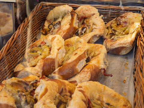 Freshly Baked Savory Pastries with Filling in Display Basket