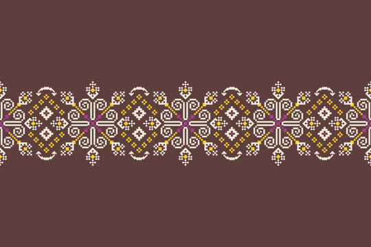 Ornate pixel border with repeating geometric motifs, floral details, and symmetrical elements in cream, magenta, yellow, and brown on a dark brown background.