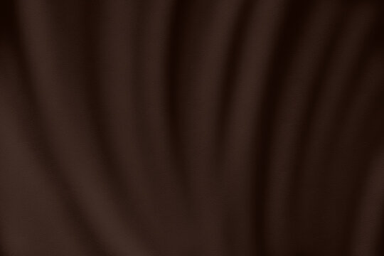 Abstract elegant background featuring soft drapery waves and folds in rich dark brown leather texture. Luxurious material surface perfect for premium design projects and stylish product mockups.