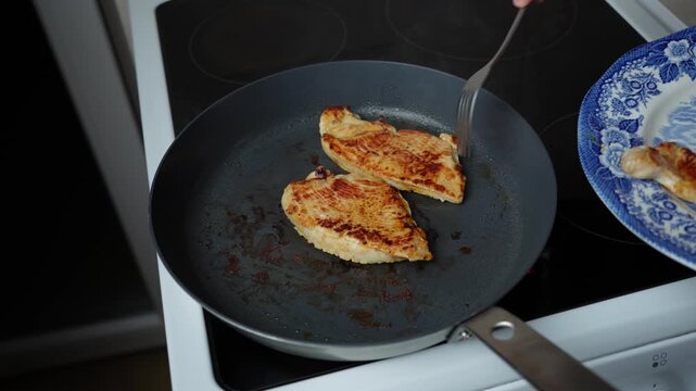 Serving Turkey Steaks on a Blue-and-White Plate. Golden-brown turkey steaks are served on a classic blue-and-white porcelain plate with a decorative floral pattern.
