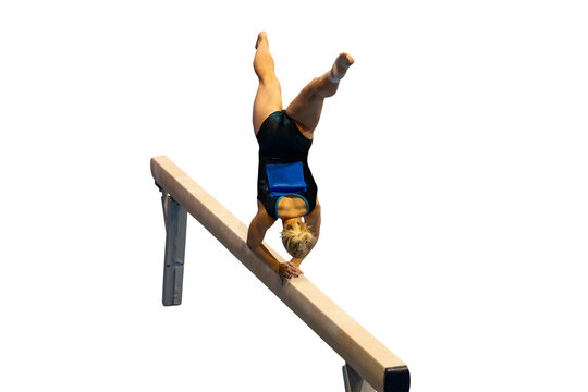 Female gymnast performing cross handstand in split position on balance beam