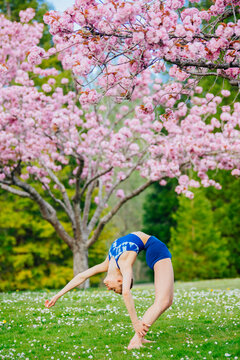 White woman performing backbend yoga pose