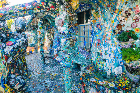 Colorful mosaic art installation with decorated columns and walls