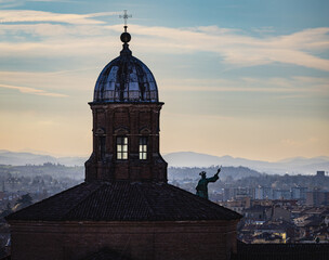 Basilica di San Petronio dome with statue over Bologna cityscape © Michael Niehaus
