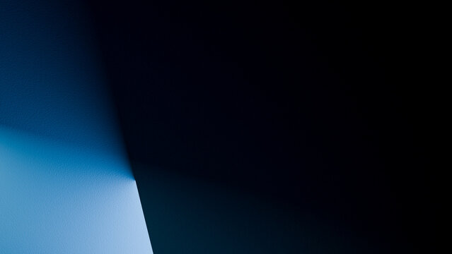 Corner of wall illuminated with blue light casting shadows