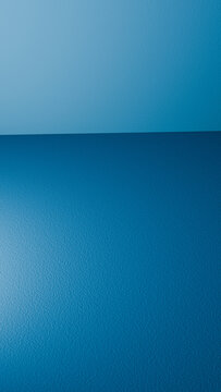 Blue textured wall and floor corner in empty room interior