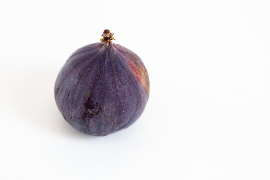 fresh purple fig isolated on white background