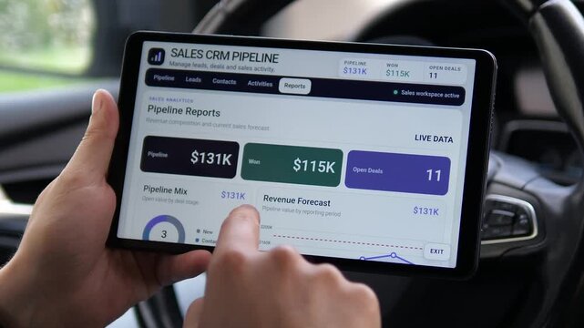 Business professional reviews sales pipeline metrics and revenue forecasts on a tablet, highlighting CRM analytics, deal tracking and data-driven sales management.