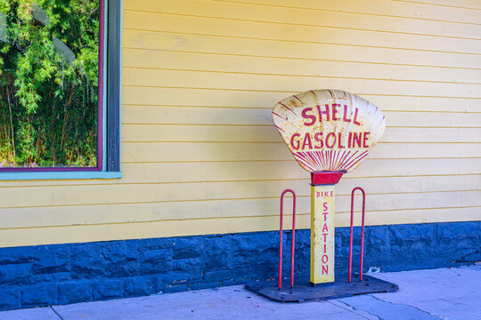 New Orleans, LA, USA - August 22, 2026: Antique Shell Gasoline Bike Station in front of Parkway Bakery Restaurant and Bar in Mid City Neighborhood