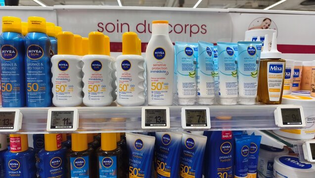 Royan, France - July 25, 2026: E.Leclerc ROYAN CEDEX. NIVEA sun protection products displayed on a retail shelf, featuring various sunscreen bottles and labels in a well-lit store environment