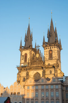 Church of Our Lady before T&yacute;n illuminated by warm sunlight in Old Town Square, Prague, Czech Republic.