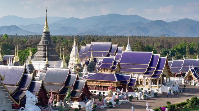 sunny day flight over chiang mai area famous temple complex front exterior mountains background aerial timelapse panorama 4k thailand   