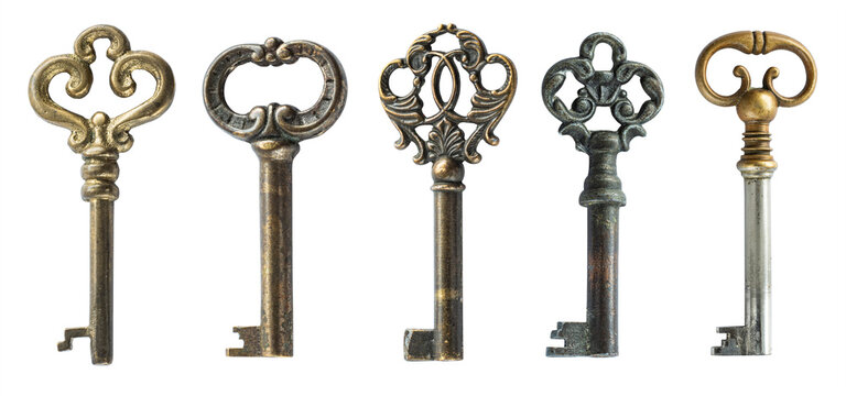 Collection of antique decorative keys with ornate bows and aged metal surfaces, isolated on a white background. Vintage historical keys suitable for interior design and decorative projects.