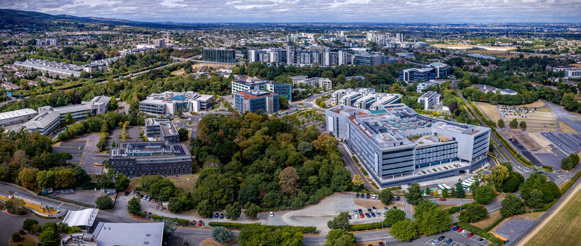 Aerial panorama of modern office buildings, corporate headquarters and green trees of Sandyford Business District in Dublin Ireland.