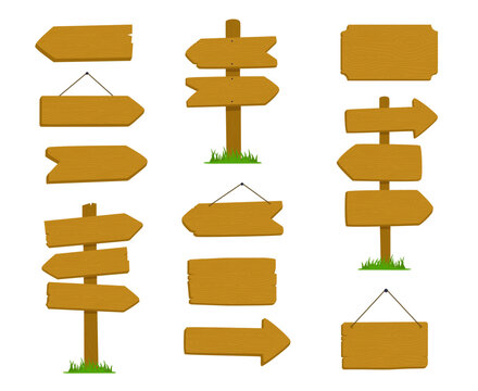 Several wooden signs and pointers stand upright or hang against a white background.