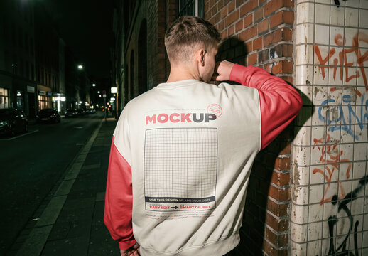 Man Wearing Sweatshirt on Street Night Back Hard Flash Mockup