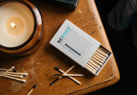 Matchbox Mockup with Candle on Table