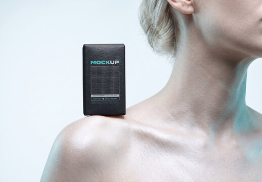 Model Presenting Packaging Box on Shoulder Mockup