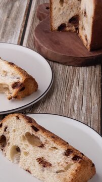 Chocotone, traditional italian cake panettone with chocolate chips over wooden table