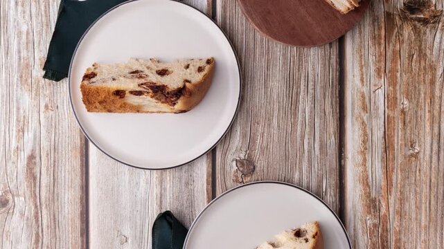 Chocotone, traditional italian cake panettone with chocolate chips over wooden table