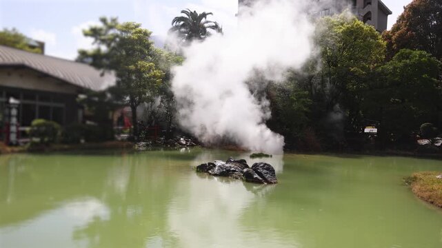 Shiraike Jigoku, "White Pond Hell", Kannawa, Beppu City, Beppu Jigoku, Japan, steaming hot spring pond at Hells of Beppu tour, Oita Prefecture, Kyushu Island, vivid mineral colored geothermal water