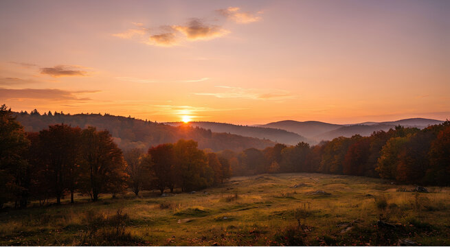 Golden Sunset Horizon: Vibrant sunset sky casting warm light over a rolling autumn landscape