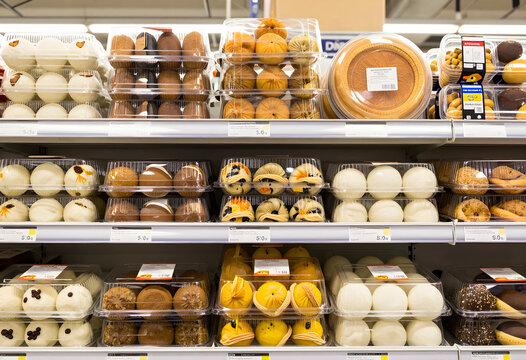 Retail grocery and food industry, variety of packaged steamed buns and traditional bakery products on supermarket shelves for consumer shopping
